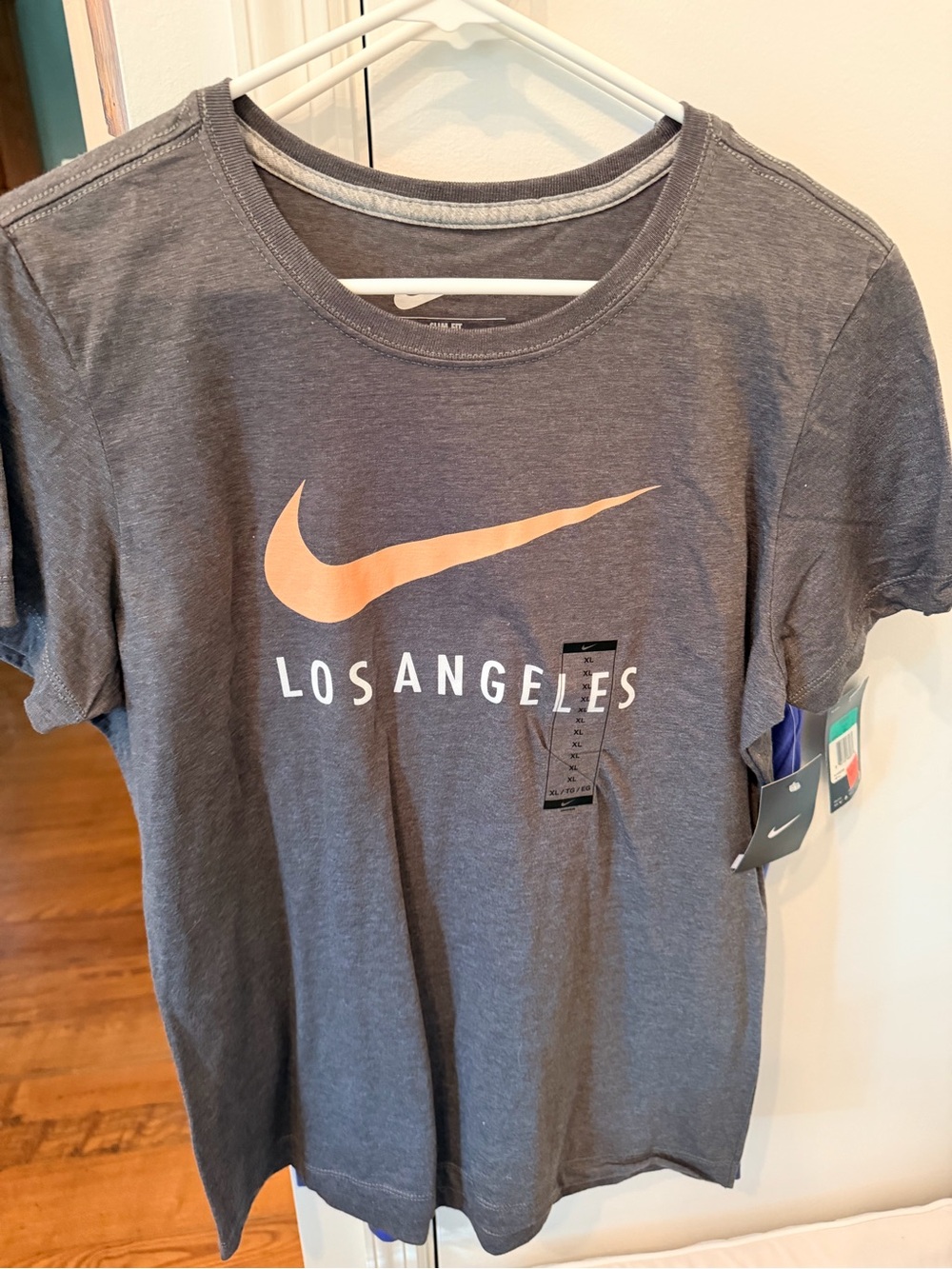 Nike Gray women’s XL slim fit Tee with Peach Swoosh & Los Angeles Text